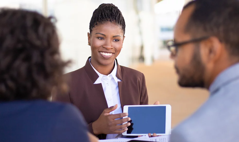 joyful-successful-sales-agent-presenting-content-tablet