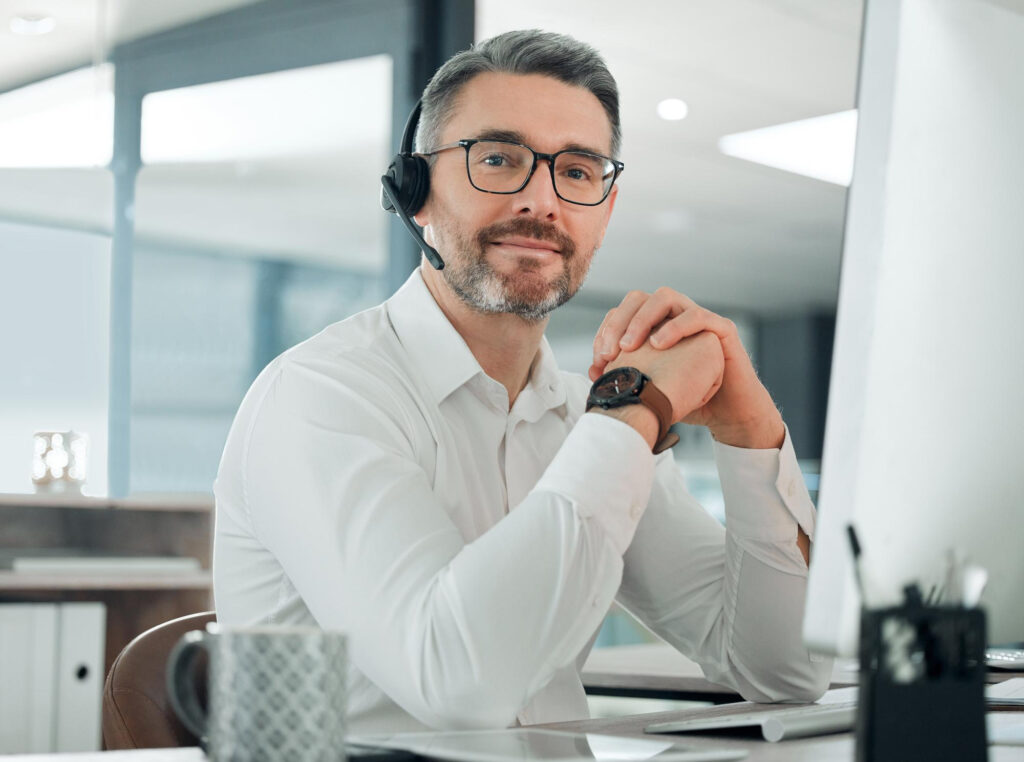 sales rep sitting in front of his computer