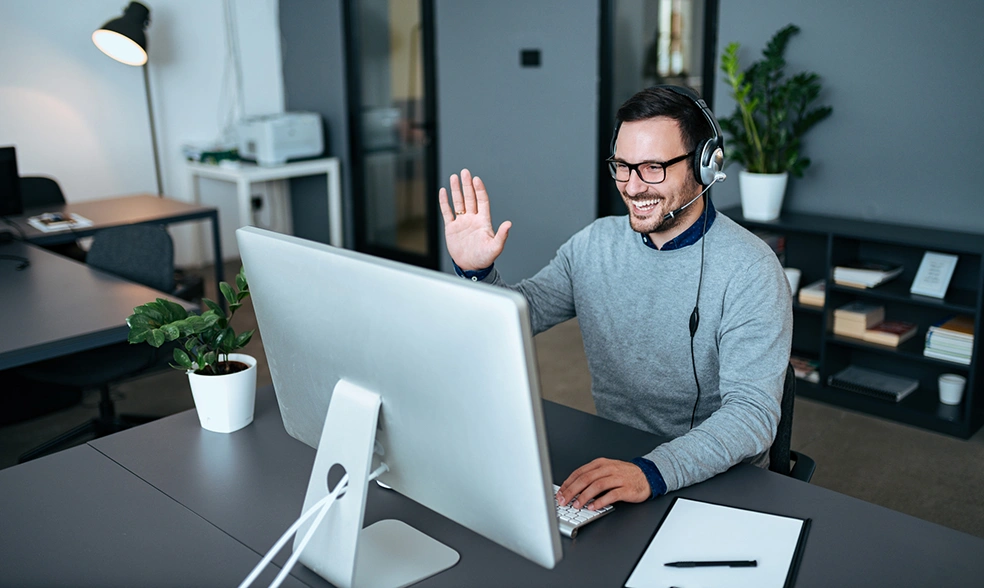 customer-support-agent-greeting-his-clients-via-video-call